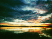 A burning sunset lights up the sky over watery pans in the Makgadikgadi Pans, Botswana.