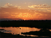 A fiery sunset lights up the salt pans in the Nsefu Sector of South Luangwa National Park, Zambia