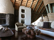 Sun floods the airy lounge at Singita Boulders Lodge, Sabi Sands, South Africa.